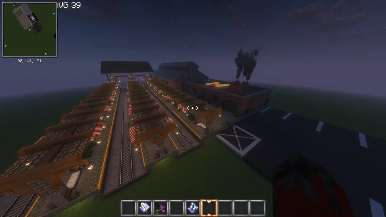 Big Train Station with 3 tracks and 5 bays to build trains in and also car parking and a helli pad on the roof